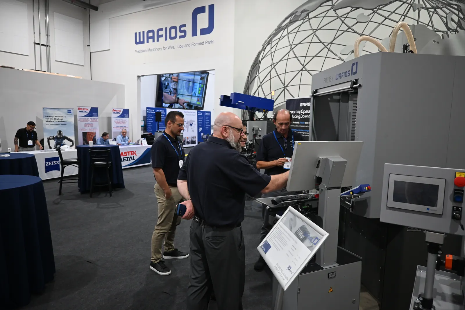 Guests at a machine demo on the Midwest Technical Center floor